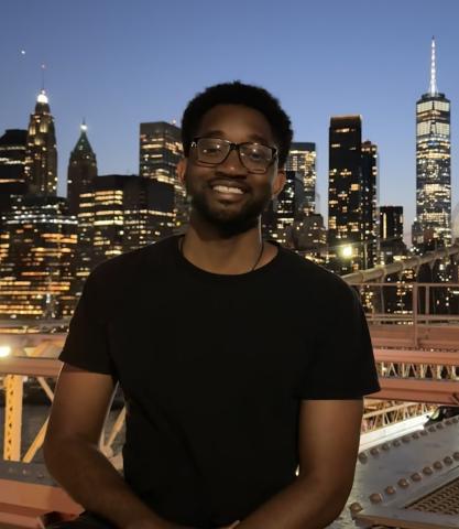 Wille Crawford at night with New York City skyline in background